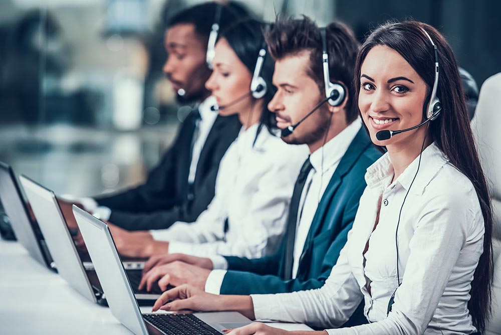 Employees in a call center answering the phone.